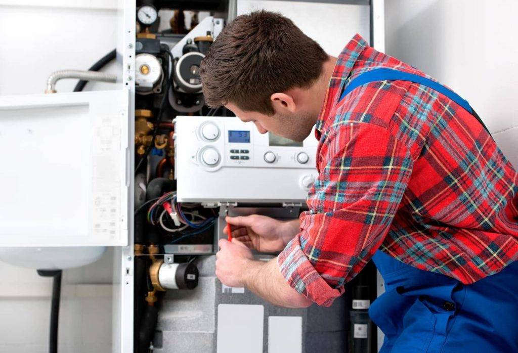 Technician Servicing Heating Boiler 1440